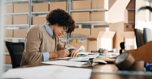 man-writing-documents-distribution-warehouse-260nw-2558546911.jpg